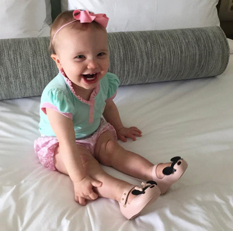 little girl wearing bow headband