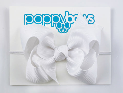 white baby girl headband with big large bow on elastic