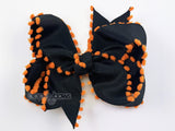 Halloween hair bow baby girl on clip, black and orange pom poms