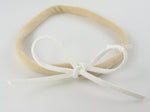 white suede tie bow on nylon baby girls headband
