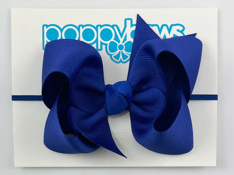 royal blue baby girl bow headband on elastic