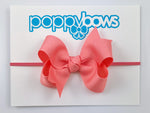 coral baby headband with bow on elastic