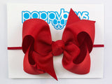 red baby girl bow headband on elastic
