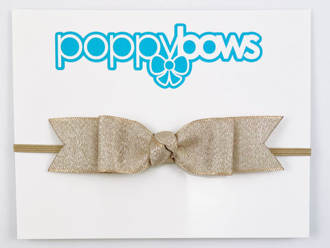 light gold baby girl headband with long bow on elastic