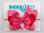 hot pink baby bow headband on elastic