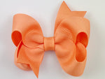 light orange baby girl 3 inch hair bow