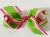green and pink hair bow