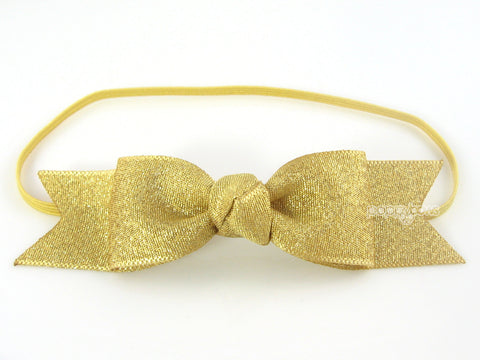 gold baby girl bow headband on elastic