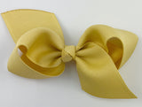 dijon mustard yellow athletic gold hair bow for baby girl