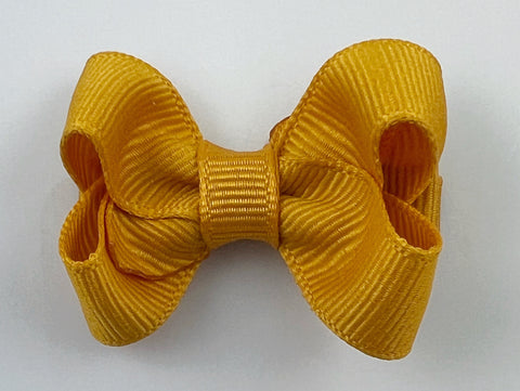 small 2 inch baby girls hair bow in mustard yellow