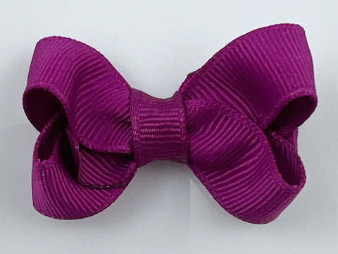 small 2 inch hair bow in magenta purple