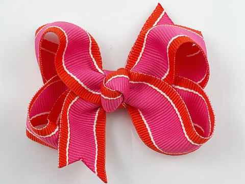 orange and pink striped hair bow