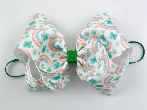 baby headband with shamrocks and rainbows in pastel and green for st. patricks day