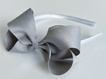big girls headbands, hard headbands, lined headbands with bows, back to school headbands, headbands with bows for girls, school headbands, bow headbands u shaped plastic band, grosgrain ribbon bow headbands toddlers big girls 4” 4 inch big large bow, gray, grey, millennium silver