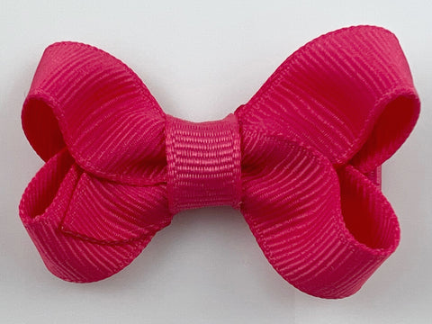 small bright pink coral hair bow