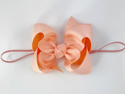 peach big bow baby girl headband on elastic