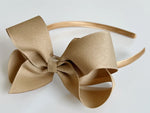 big girls headbands, hard headbands, lined headbands with bows, back to school headbands, headbands with bows for girls, school headbands, bow headbands u shaped plastic band, grosgrain ribbon bow headbands toddlers big girls 4” 4 inch big large bow, khaki, beige, back to school uniform, tan