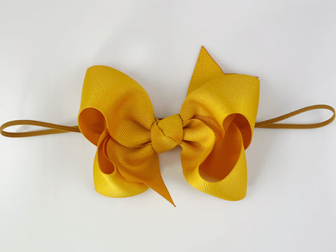 mustard yellow baby girls bow headband on elastic