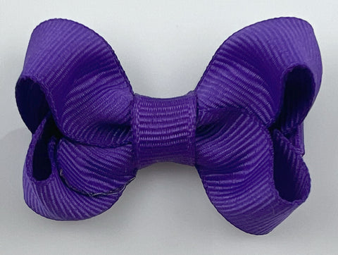 small baby hair bow in bright dark purple