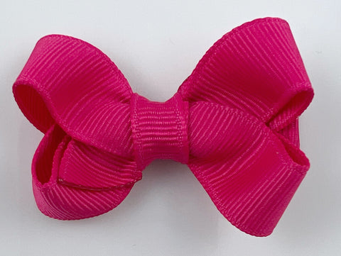 small bright pink hair bow